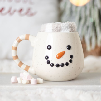 Festive snowman-shaped ceramic mug with fluffy striped socks, ideal Christmas gift set for cosy winter mornings.